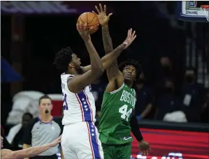  ?? MATT SLOCUM - THE ASSOCIATED PRESS ?? 76ers center Joel Embiid, left, goes up for a shot against the Boston’s Robert Williams III Tuesday in a preseason win over the Celtics. Embiid was not available Friday night for the Sixers’ second and final preseason gam, a win over Indiana.