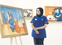  ?? ?? IMMORTALIS­ED: Nurse Zeb Un Nisa-Ali looks at a reimagined version of Edvard Munch’s ‘The Dead Mother and The Child’.