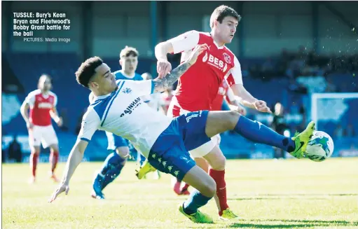  ?? PICTURES: Media Image ?? TUSSLE: Bury’s Kean Bryan and Fleetwood’s Bobby Grant battle for the ball