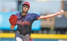  ?? AP PHOTO/CHARLIE NEIBERGALL ?? Atlanta Braves starter Chris Sale pitches during a spring training game against the Pittsburgh Pirates on Feb. 27 in Bradenton, Fla. Sale, an offseason addition from the Boston Red Sox, could provide the rotation a boost and the team an extra mental edge — as long as he remains healthy.