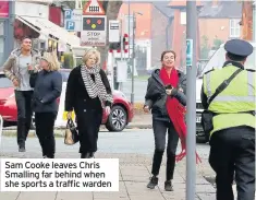  ??  ?? Sam Cooke leaves Chris Smalling far behind when she sports a traffic warden