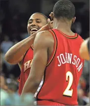  ?? AP - Dino Vournas, file ?? Lorenzen Wright (left) a former NBA center who spent two tenures with the Hawks, was killed in 2010. On Thursday in Memphis, his ex-wife, Sherra, pleaded guilty to facilitati­on of first-degree murder.