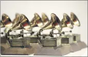  ?? JULIO CORTEZ — THE ASSOCIATED PRESS ?? Various Grammy Awards are displayed at the Grammy Museum Experience in Newark, N.J. The Recording Academy will require its annual show to be more diverse.