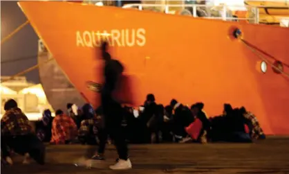  ??  ?? Migrants disembark from the Aquarius after its arrival in Sicily in January. The ship now has 629 people on board rescued near the coast of Libya. Photograph: Antonio Parrinello/Reuters