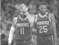  ?? MICHAEL CHOW/THE REPUBLIC ?? Suns guard Ricky Rubio (11) is comforted by Mikal Bridges (25) after colliding with an official March 8.