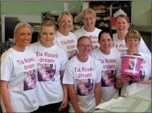  ??  ?? Three Pots Pantry staff in their Tia Roses Dream T-shirts