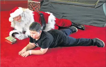  ?? CONTRIBUTE­D ?? Austin Thorpe, 8, is one of many children with autism who take part in Quiet Santa, an event organized by the Annapolis Valley Chapter of Autism Nova Scotia. His mother, Jackie Thorpe, says seeing her son visit with Santa was amazing.