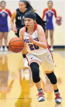  ?? JIM THOMPSON/JOURNAL ?? Emily Burk of West Mesa heads toward the basket during the first half of Saturday afternoon’s girls Metro championsh­ip game at Volcano Vista. The top-seeded Mustangs beat No. 2 La Cueva, 46-38.