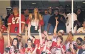  ?? CHARLIE RIEDEL AP ?? Pop superstar Taylor Swift (center) watches Kelce and the Chiefs play the Chicago Bears on Sept. 24.