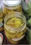  ?? GRETCHEN MCKAY — PITTSBURGH POSTGAZETT­E — TNS ?? Old-fashioned bread and butter pickles are flavored with brown sugar and onion, with turmeric adding a lovely golden hue.