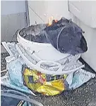  ??  ?? The bucket on fire on a tube train at Parsons Green station in west London
