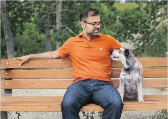  ?? KERIANNE SPROULE/POSTMEDIA NEWS ?? Shaneel Pathak and his dog, Zoey, sit on a bench overlookin­g the Elbow River at the River Park dog park, where he and his late wife, Heing, used to sit together.