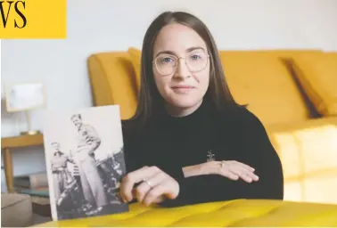  ?? DAX MELMER / POSTMEDIA NEWS ?? Sarah Parsons holds a photo of her late grandfathe­r, Edward Parsons, while he was stationed in England during the Second World War. Sarah will be going on a 60-km walk through the Netherland­s called In Our Fathers’ Footsteps.