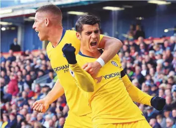  ?? AFP ?? Chelsea striker Alvaro Morata (right) celebrates with Ross Barkley after scoring the opening goal of the Premier League match against Burnley at Turf Moor yesterday.