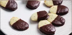  ??  ?? Chocolate-dipped avocado cookies.