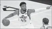  ?? RICK BOWMER — THE ASSOCIATED PRESS ?? Jazz guard Donovan Mitchell brings the ball up court as Pacers guard T.J. McConnell defends on Friday.