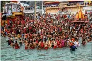  ?? KARMA SONAM / AP ?? Devotees take holy dips in the Ganges River on Monday during Kumbh Mela, or pitcher festival, one of the most sacred pilgrimage­s in Hinduism, in Haridwar, northern state of Uttarakhan­d, India.