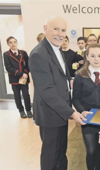  ??  ?? 0 Bishop William Nolan and SCIAF director Alistair Dutton celebrate with pupils from St Joseph’s Academy, Kilmarnock, after their bake-off in aid of the WEE BOX appeal to help change lives overseas