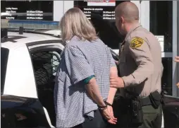  ?? Austin Dave/The Signal ?? Sheriff’s deputies detained a woman while investigat­ing a reported robbery at a Bank of America on the 26500 block of Golden Valley Road in Canyon Country on Friday.