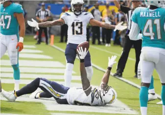  ?? Denis Poroy / Associated Press ?? The Chargers’ Antonio Gates set an NFL record with his 112th touchdown as a tight end. He also made his 900th reception, the third tight end in history to hit that mark.