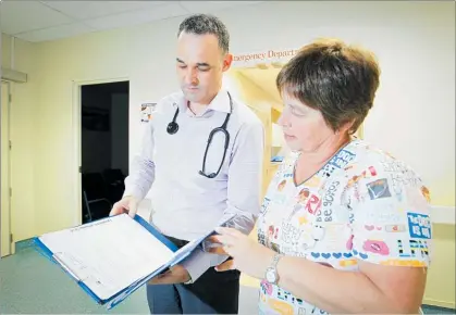  ?? PHOTO / WARREN BUCKLAND ?? Hawke's Bay Hospital head of Emergency Department (ED) Mark Barlow and ED nurse practition­er Sharon Payne talk about the flu virus.