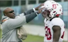  ?? RICK RYCROFT — THE ASSOCIATED PRESS ?? Stanford’s players Bryce Love, right, and Cameron Scarlett get instructio­ns from running backs coach Ron Gould, left, before running through a drill as the team trains in Sydney, Australia, Stanford will play Rice Down Under on Sunday.