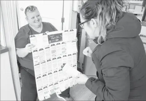  ?? ALISON JENKINS/ JOURNAL PIONEER ?? Kin Canada volunteer Sue Gallant holds the Seniors’ Angel Tree tags for Kolby Perry. The initiative is a way to help brighten up someone else’s season, with more than 300 Summerside seniors receiving gifts last year.