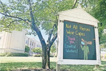  ?? [BARBARA J. PERENIC/DISPATCH] ?? A sign outside Montrose Elementary School in Bexley recognizes essential workers during the coronaviru­s pandemic. Bexley’s schools are among those that will begin the new school year with strictly online learning.