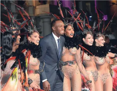  ?? RICARDO MAKYN/ STAFF PHOTOGRAPH­ER ?? Usain Bolt with dancers at the world premiere of his film, ‘I Am Bolt’, at the Odeon Leicester Square Cinema in London.