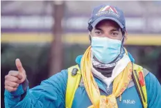  ?? — AFP ?? Bahrain’s Prince Mohammed bin Hamad gestures as he arrives at the Tribhuvan Internatio­nal Airport after successful­ly climbing Mount Everest.