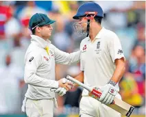  ??  ?? Respect: Steve Smith (left) congratula­tes Alastair Cook on his innings at the end of the third day’s play