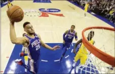  ?? CHRIS SZAGOLA — THE ASSOCIATED PRESS ?? Ben Simmons goes up for a dunk in the second quarter against the Los Angeles Lakers on Thursday.