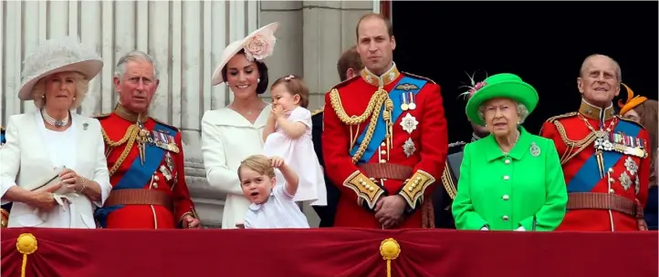  ??  ?? ROYAL DECORUM: The Duke and Duchess of Cambridge, centre, with their children Princess Charlotte and Prince George, with Queen Elizabeth II and the Duke of Edinburgh, right, and the Duchess of Cornwall and the Prince of Wales, left, on the balcony of...