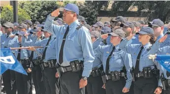  ?? MITCH DUDEK/SUN-TIMES ?? Chicago police recruits honor Officer Michael Gordon at a memorial Wednesday.