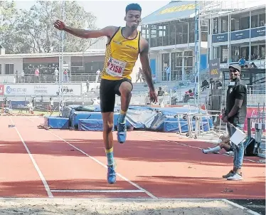  ?? Picture: NELLIS BOTHMA ?? BIG REACH: Bestmed Madibaz athlete Chrissio Roberts competes in the long jump at the athletics meeting at the Madibaz Stadium last weekend