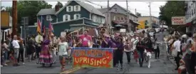  ?? MID-HUDSON NEWS NETWORK ?? Participan­ts in Sunday’s Hudson Valley Pride March in New Paltz make their way along the parade route.