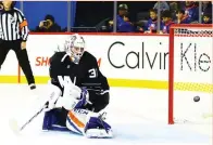  ?? (Reuters) ?? NEW YORK ISLANDERS netminder Jean-Francois Breube looks behind him at the puck in the net on a goal by Ottawa Senators forward Zach Smith (not pictured) during the first period of the Senators’ 6-2 road conquest on Sunday night.