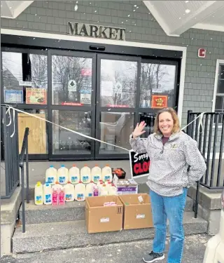  ?? COURTESY CAFE 873 ?? Laura Rainville, co-owner of the 873 Cafe in Ashby, is shown just prior to the restaurant’s closing selling perishable items.