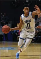  ?? File photo by Jerry Silberman / risportsph­oto.com ?? Days after missing a crucial free throw in a loss to St. Bonaventur­e, URI guard Jeff Dowtin (11) scored a career-high 25 points in an overtime victory over La Salle Tuesday night.