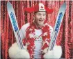  ?? JEFF MCINTOSH THE CANADIAN PRESS ?? Former Olympian Michael Edwards, also known as Eddie the Eagle, in a photo booth at an Olympic rally in Calgary on Nov. 5.