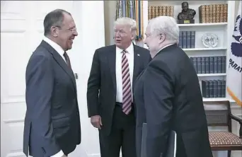  ?? Russian Foreign Ministry via Associated Press ?? President Donald Trump meets with Russian Foreign Minister Sergey Lavrov, left, next to Russian Ambassador to the U.S. Sergei Kislyak on Wednesday at the White House.