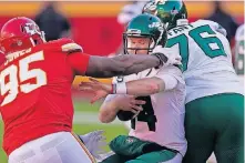  ?? THE ASSOCIATED PRESS] ?? Kansas City Chiefs defensive tackle Chris Jones (95) pressures as New York Jets quarterbac­k Sam Darnold (14) fights out of Jones' grasp in the second half on Nov. 1 in Kansas City, Mo. [CHARLIE RIEDEL/