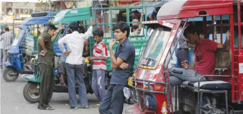  ??  ?? AHMADABAD: Indian delivery truck drivers wait for customers at a wholesale market in Ahmadabad yesterday. A lot of regular activities involving payment in cash is seeing at least a temporary slowdown after Indian Prime Minister Narendra Modi announced demonetiza­tion of India’s 500 and 1,000-rupee notes, which made up 86 percent of the country’s currency. — AP