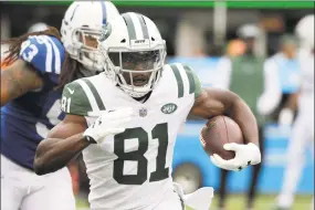  ?? Seth Wenig / Associated Press ?? New York Jets wide receiver Quincy Enunwa runs with the ball against the Indianapol­is Colts on Oct. 14 in East Rutherford, N.J. The Jets have signed Enunwa to a contract extension, keeping one of their key offensive players who was scheduled to be a free agent in the offseason.