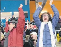  ?? MITCH MACDONALD/THE GUARDIAN ?? Lawrence McKnight, left, and Paula MacKay cheer on their son, Joshua McKnight, and his team the Central Attack during the Midget AAA final against the Pownal Red Devils at the 43rd annual Spud Hockey Tournament. The team won the game 3-2.