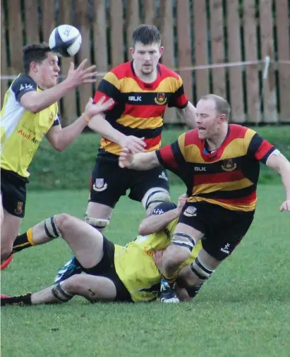  ??  ?? Simon Coulter is tackled in the J1A game against Buccaneers in Hamilton Park.
