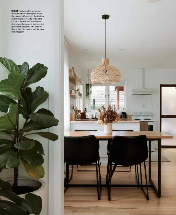  ??  ?? DINING Replacing the patterned lino with timber flooring has made the biggest di erence in the kitchen and dining space, and painting the kitchen cabinets and island white also helped bring some light into the space (see opposite). The pendant light is from Corcovado and the table from Freedom.