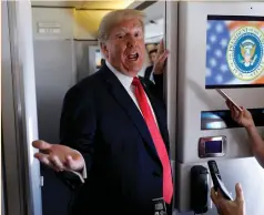  ?? (Kevin Lamarque/Reuters) ?? US PRESIDENT Donald Trump speaks to reporters aboard Air Force One last week.