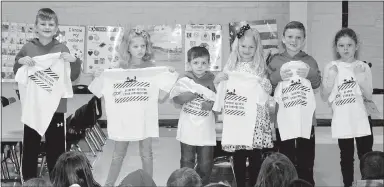  ?? Submitted Photo ?? “Pawsitive” and Wise Student award winners for the month of April at Glenn Duffy Elementary School display the T-shirts they received. Students were honored at the school’s Rise and Shine assembly April 2. PAWS winners for the month are Logan Hall...