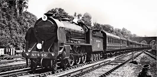  ?? Revd A C Cawston/John Whiteley Collection ?? During the 1920s and 1930s the Urie and Maunsell ‘N15s’ held sway on the Waterloo to Salisbury and Exeter main line as the ‘Lord Nelsons’ were rarely seen west of Salisbury. Sometime after May 1932 when Sir Lamorak lost the ‘E’ suffix to its running number, No 451 is seen passing Surbiton in charge of a down West of England express. With 12 coaches behind the tender, the driver is making the most of the favourable gradients towards Hampton Court Junction. Although nominally less powerful than the four-cylinder ‘Lord Nelsons’, the ‘N15s’ were able to run heavy trains to time and with a good engine and an enthusiast­ic crew it was not unknown for a ‘King Arthur’ to outperform a ‘Lord Nelson’.